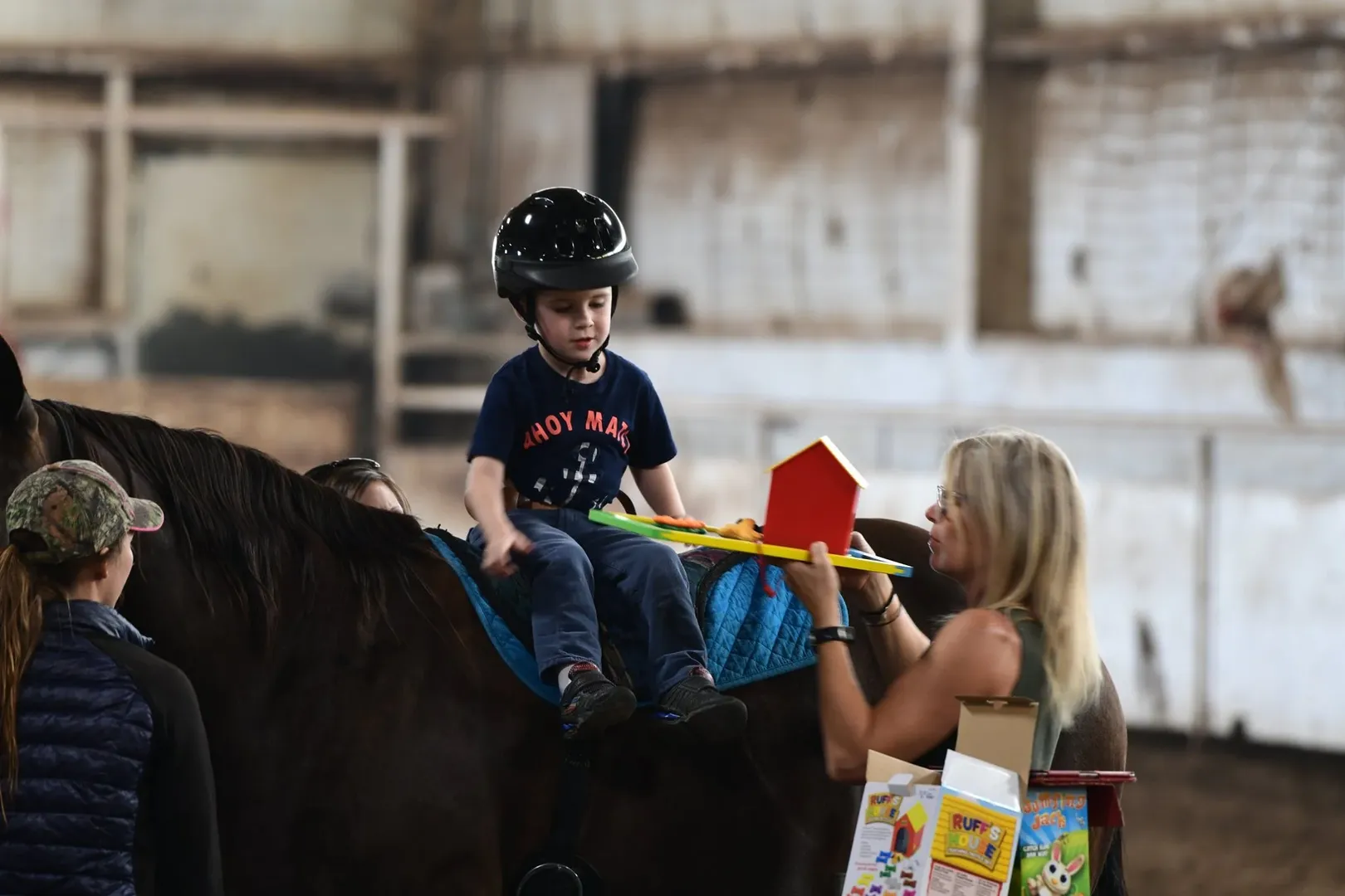 Child and horse at Coyote Creek Riding Arena